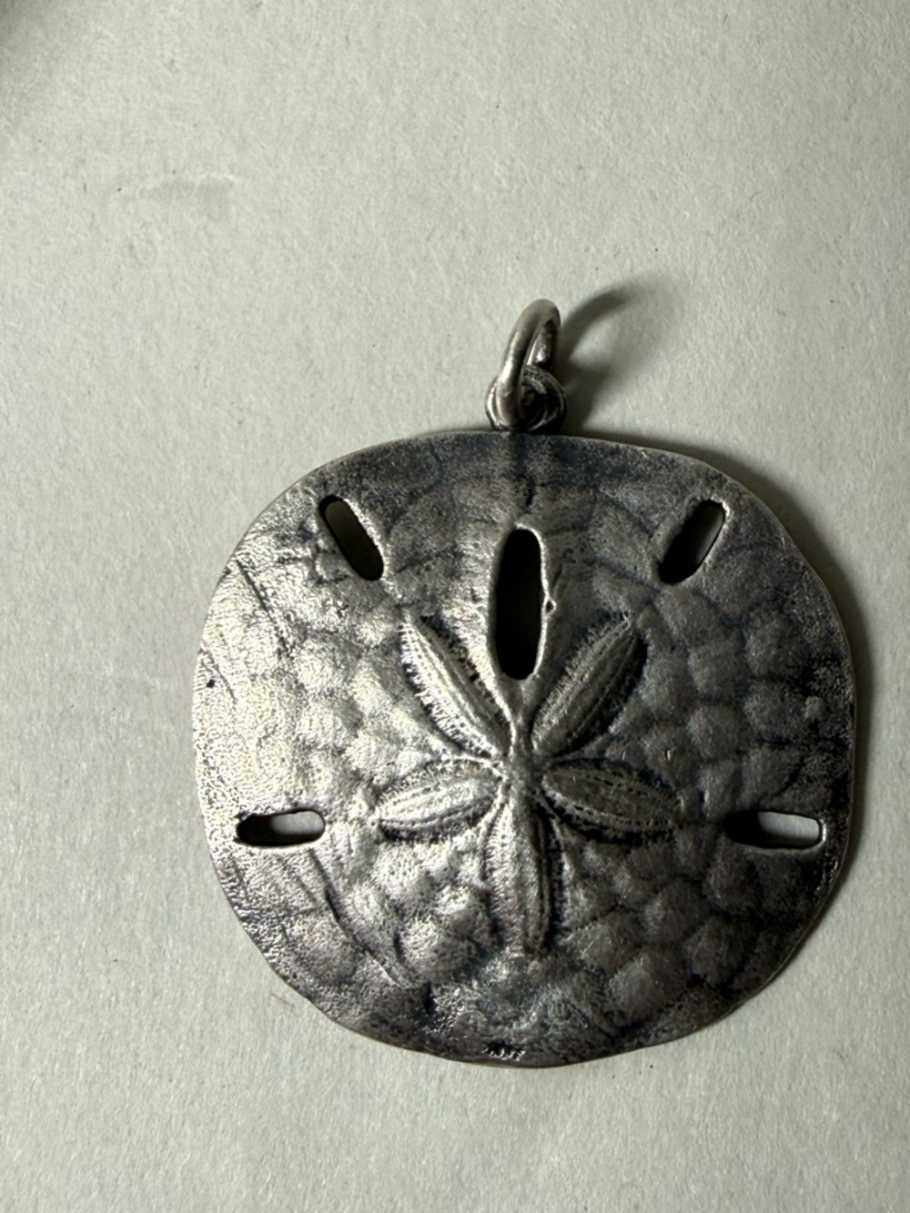 Retired James Avery Sand dollar pendant